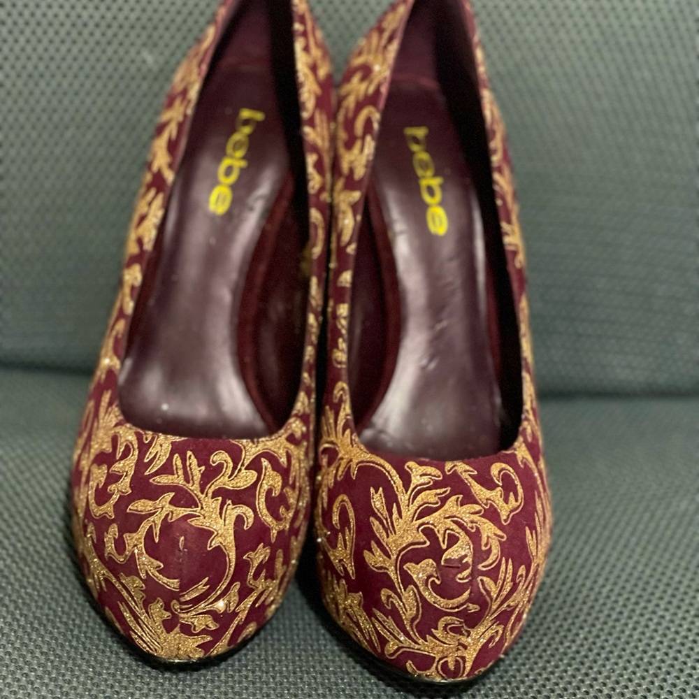 Bebe Glam Burgundy suede platform pumps. 5” heels with a 2” Platform.